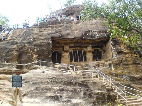 Pandava Caves carved into the sandstone hill